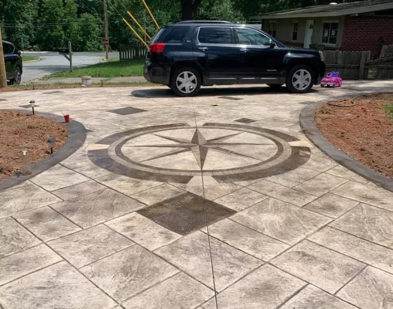 Stamped concrete driveway with compass design pattern