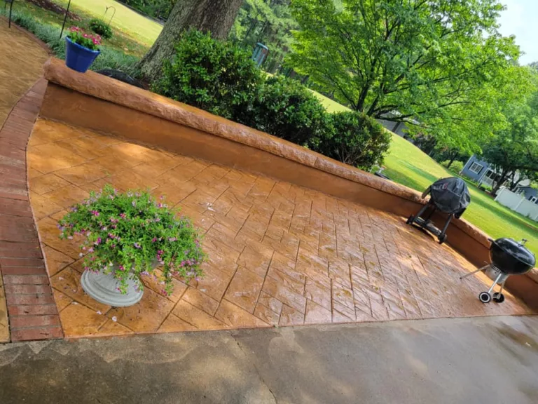 Stamped concrete patio and seat wall with garden planters