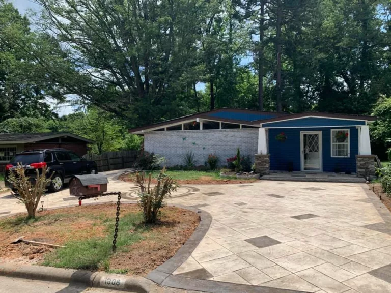 Finished decorative concrete driveway in front of a home